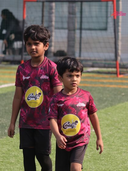 Two of our youngest players on the field, focused and ready for action in their DPDL match.