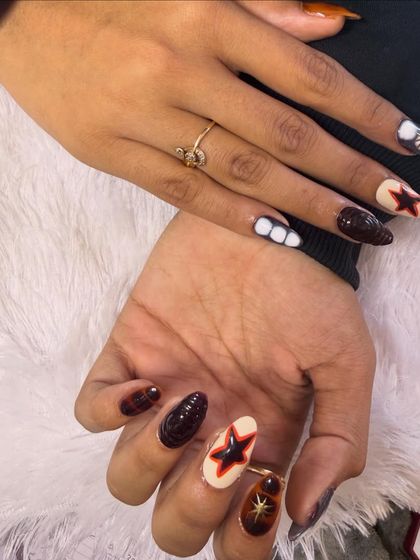 A trendy and edgy design for those who love a darker aesthetic. This set features hand-painted stars and abstract patterns in a rich brown, black, and cream color palette.