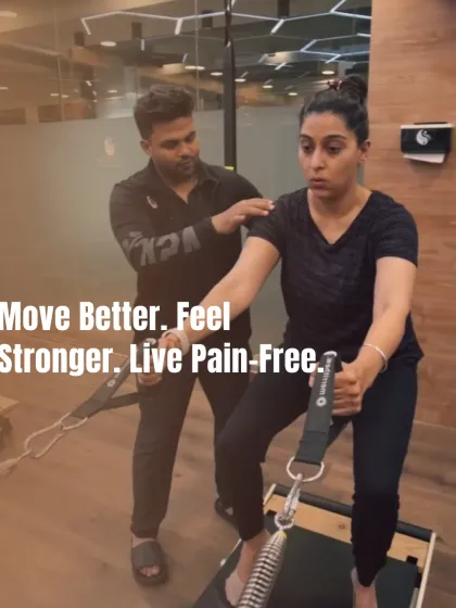 I believe in a hands-on approach. Here, I'm providing a client with specific tactile cues to ensure correct shoulder and back alignment, which is crucial for safe and effective movement.