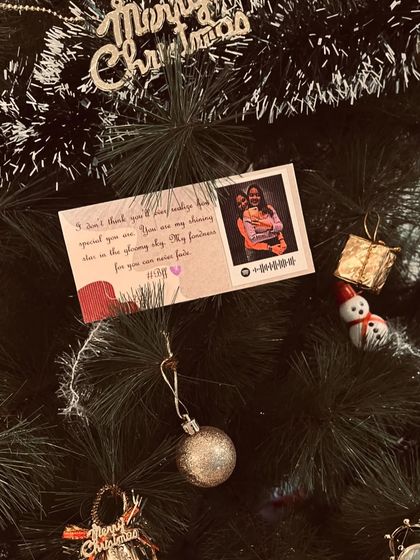 Another look at a personalized card used as a Christmas tree decoration.