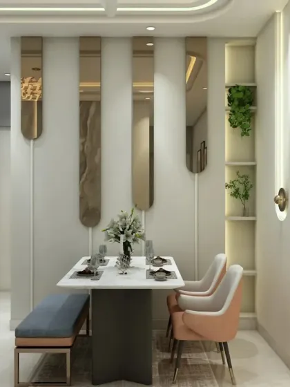 We design compact dining areas that are both stylish and functional. This setup includes a sleek dining table with a bench and chairs, complemented by decorative mirrors and built-in shelving.