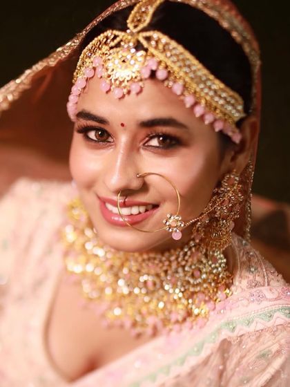A stunning close-up that highlights her beautiful eyes and the delicate details of her makeup and jewelry.