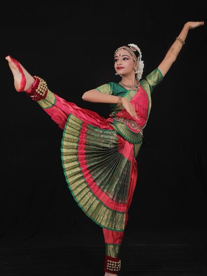 A perfectly captured pose by Tanmayi. The flexibility and control required for such postures are developed over years of practice.