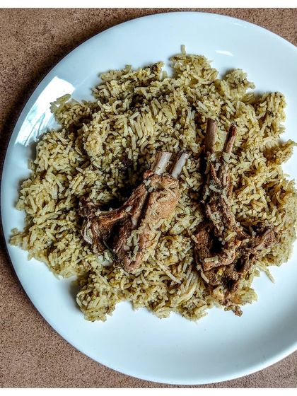 A plate of my family's favourite, the Bannur Mutton Palav. Made with fatty mutton and aromatic Basmati rice cooked in a rich mutton broth, it's a truly indulgent meal.
