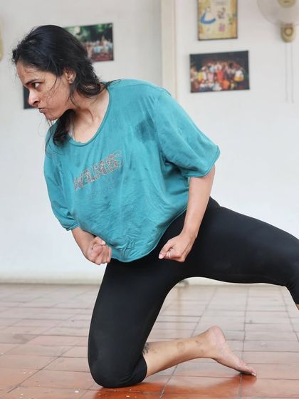An actor in a powerful pose during a "Gretel" rehearsal.