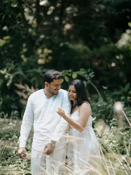 A playful, interactive moment between the couple during their nature-themed pre-wedding shoot.