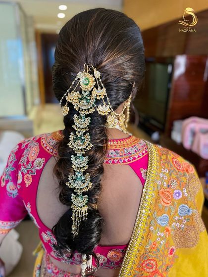 Beauty in the details! A stunning, traditional braid adorned with heavy jadau jewellery.