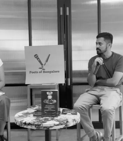 A black and white photograph of an intense moment during the author interview, highlighting the deep conversations that take place.