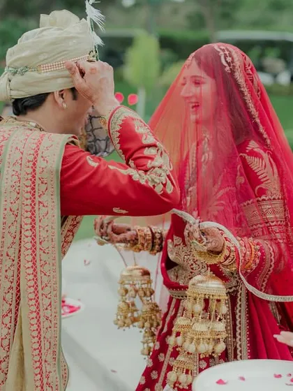 A playful moment during the wedding ceremony. We believe in capturing the fun and lighthearted aspects of the day, not just the formal rituals.