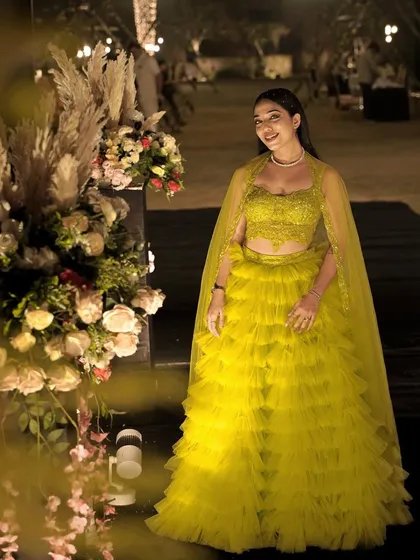 Let the light within you create magic in the world. A beautiful shot of me in a neon green lehenga, surrounded by magical floral decor.