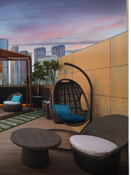 A cozy seating area on the rooftop terrace of my completed residential project in Lower Parel. The design focuses on creating intimate, comfortable spaces for residents to enjoy the city from above.