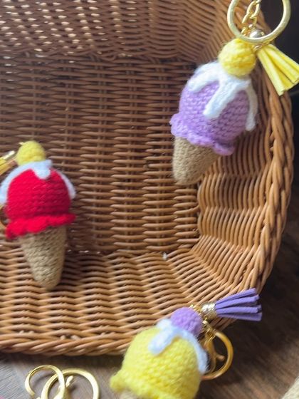 A few of our ice cream keychains in a basket, showing the different color combinations we offer, including lavender and yellow.