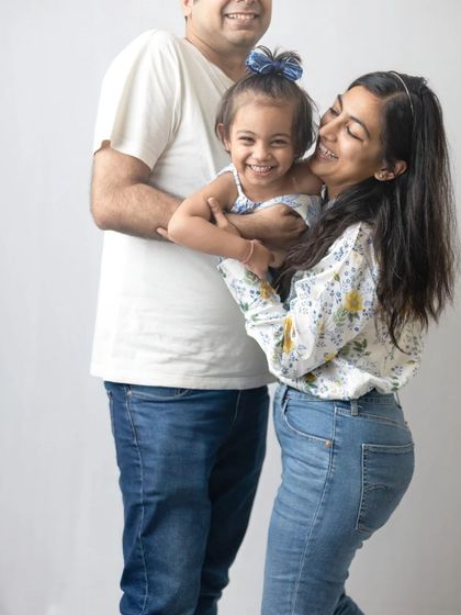 A candid moment of laughter and hugs. These spontaneous interactions are what make family photoshoots so special.