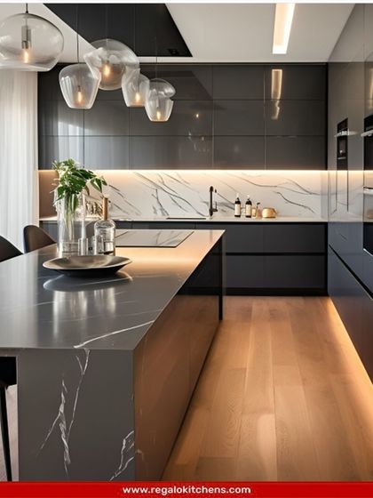 High-gloss black cabinetry and a grey marble island create a sleek, reflective surface that enhances the sense of space. We designed this kitchen for those who love a polished, ultra-modern aesthetic with clean lines and integrated appliances.