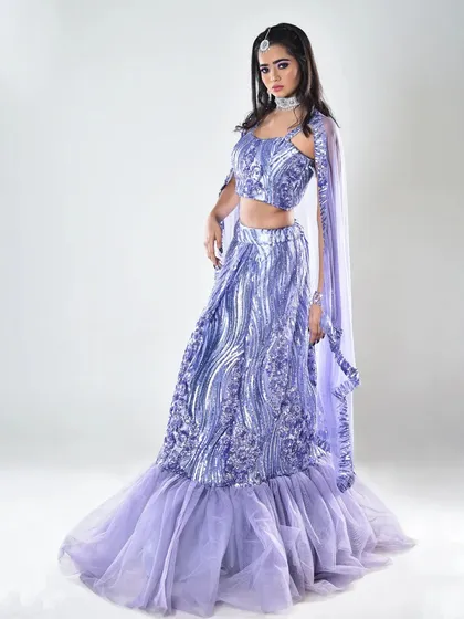 A full-glam engagement look featuring a shimmery lavender lehenga. I focused on creating a flawless base, bold eyes, and a complementary lip color to match the modern, mermaid-style silhouette of the outfit.