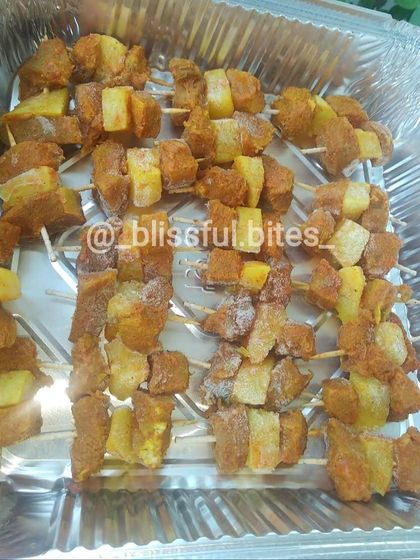 A tray of uncooked Kaadi Gosh, showing the preparation before it's fried into a succulent beef appetizer.