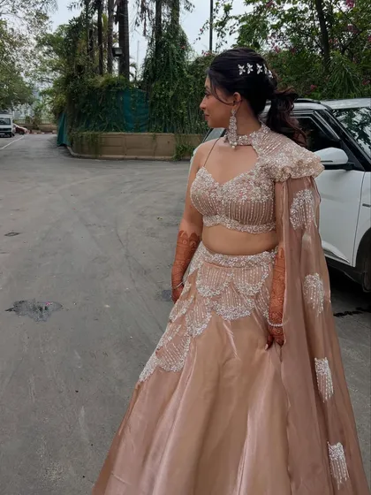 A full-length view of Simran's modern Sangeet lehenga, showing how the makeup and hair complete the entire look.