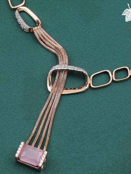 A close-up of the Blush Pink pendant, showcasing its fluid, multi-chain design.