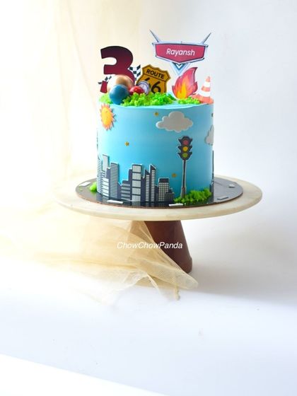 A side view of the transport cake, showing the Route 66 and flame toppers.