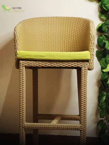 This wicker bar chair with a vibrant lime green cushion adds a pop of color to any space. The natural-looking wicker and sturdy frame blend durability with a classic, comfortable design.