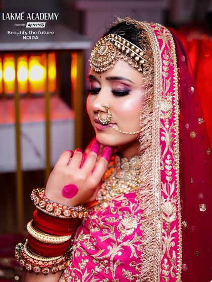 The detailed alta on the hands is a crucial part of many bridal traditions. We ensure our students learn these cultural details to provide a complete service.