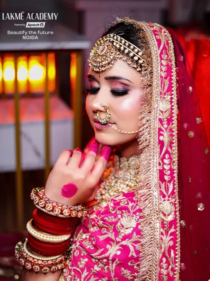 This shot focuses on the rich embroidery of the bridal lehenga and the complementary makeup. We teach students how to choose color palettes that enhance the bride's entire ensemble.