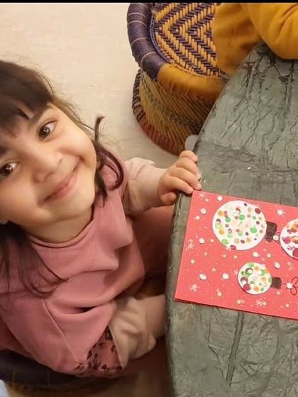 That sweet smile and her beautiful handmade Christmas card are the perfect combination. The toddlers loved this fingerprinting activity.