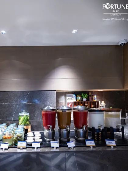 A selection of fresh juices and traditional Indian beverages like lassi and buttermilk, providing a refreshing accompaniment to your breakfast.