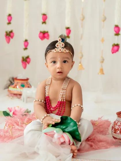 A serene portrait of a baby Krishna. Even the quiet, contemplative moments during a themed session can result in incredibly beautiful and soulful photographs.