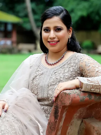 A lovely portrait that captures her happy expression. The makeup enhances her features without looking heavy.