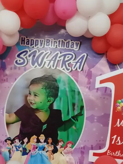 A close-up of the personalized first birthday backdrop for the Princess theme.