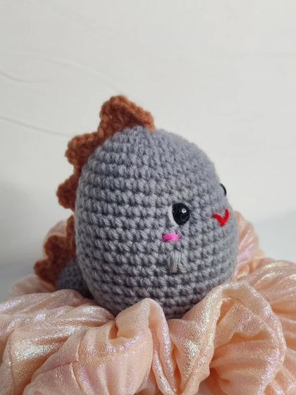 My tiny dino keychains are a handful of cuteness. They come in four different colors: blue, yellow, green, and grey.