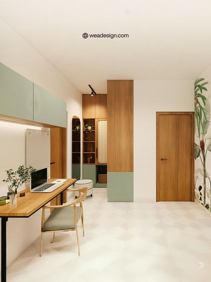 A view of the integrated study area in this minimalist bedroom, featuring a simple wooden desk and overhead cabinets that maintain the room's airy feel.