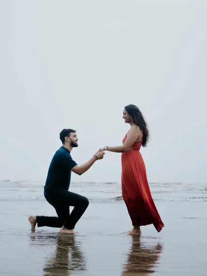 A classic proposal pose during a beach pre-wedding shoot. This timeless shot captures the promise of a lifetime together against a beautiful seaside backdrop.