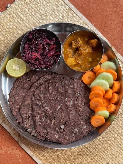 This meal is specially designed for the nutritional needs of women, particularly during pregnancy and lactation. The iron-rich ragi roti and calcium-packed amaranth leaves, paired with a protein curry and fresh vegetables, provide the essential micronutrients for both mother and baby.