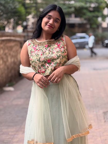 This mint green lehenga with a floral embroidered blouse is another beautiful pastel option for any pre-wedding function.