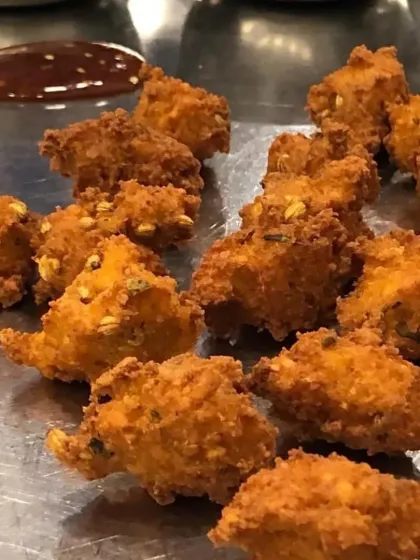 A plate of our crispy Moong Dal Vadas, served with traditional chutneys, a popular Rajasthani snack.