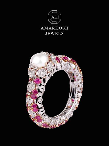 A different angle of the versatile and timeless diamond, ruby, and pearl ring.