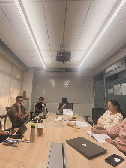 Leopards in session. A candid shot of the group in deep discussion, creating the kind of community where ideas can flourish.