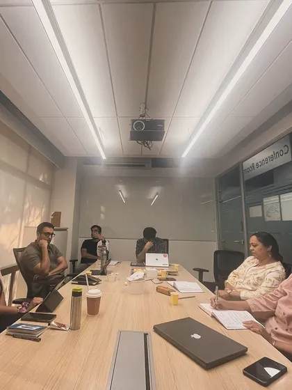 Leopards in session. A candid shot of the group in deep discussion, creating the kind of community where ideas can flourish.