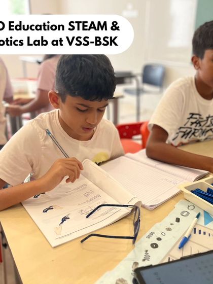 A student at VSS-BSK focuses on his workbook, documenting his designs and learning. We integrate documentation into our process to reinforce concepts and track progress.