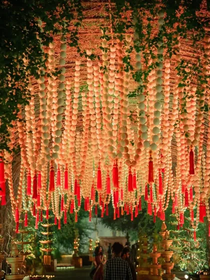 The entrance to a Sunderkand prayer meeting. I created a breathtaking tunnel of hanging mogra and marigold garlands, creating a fragrant and visually stunning welcome for guests.