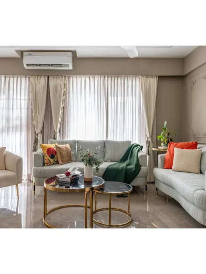 A comfortable and stylish seating arrangement perfect for family gatherings. The combination of a large sofa and an accent armchair provides flexible seating options, while the nested tables add a touch of modern functionality.