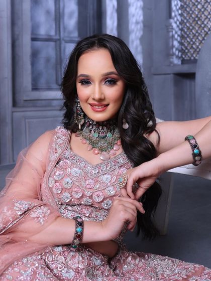 A relaxed and confident portrait. The makeup is glamorous yet approachable, perfect for inspiring brides-to-be.