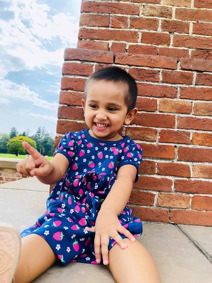 Another angle of the adorable strawberry print dress. It's perfect for a sunny day.