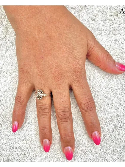 A perfect example of a classic ombré manicure. This design features a seamless gradient from a natural nude base to a vibrant pink tip, creating a beautiful and timeless look.