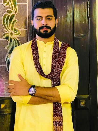 A confident pose in his Haldi attire. The makeup is minimal and natural, perfect for a daytime event.