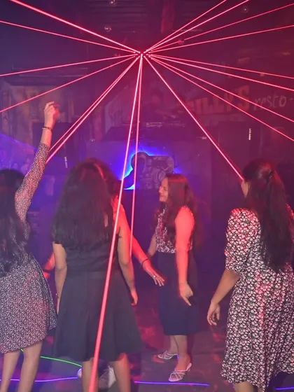 The laser web at Gilly's creates an incredible visual. Here's a group of friends dancing right in the middle of it.