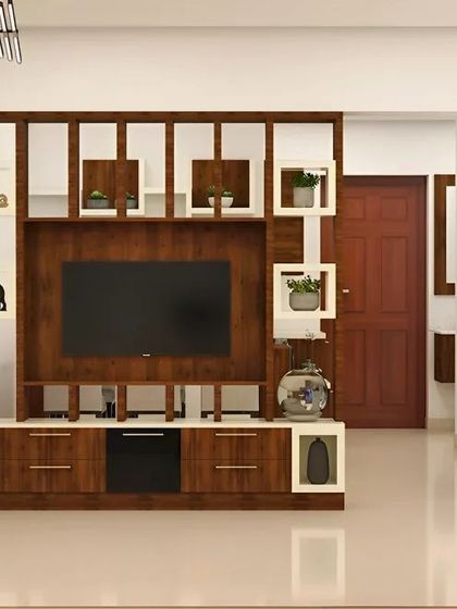 This TV unit doubles as a room partition, with open geometric shelving that allows light to pass through while creating a visual separation.