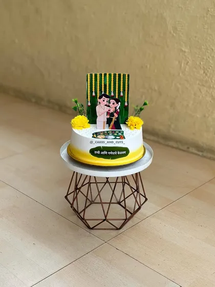 A full view of our custom Kelvan cake, designed to celebrate the couple's pre-wedding ceremony with traditional motifs.
